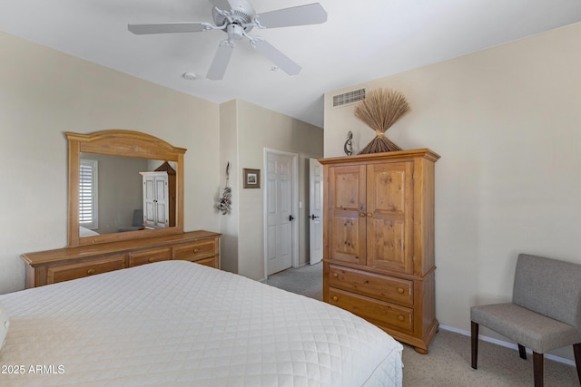 bedroom featuring light carpet, visible vents, a ceiling fan, and baseboards