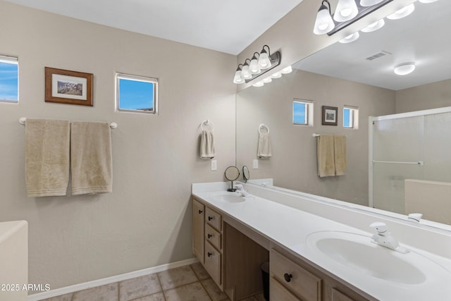 full bathroom featuring a sink, visible vents, double vanity, and a shower stall