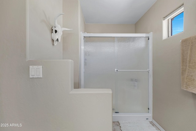 full bath featuring a shower stall