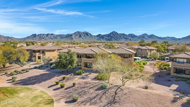 exterior space featuring a mountain view, a residential view, and a tiled roof