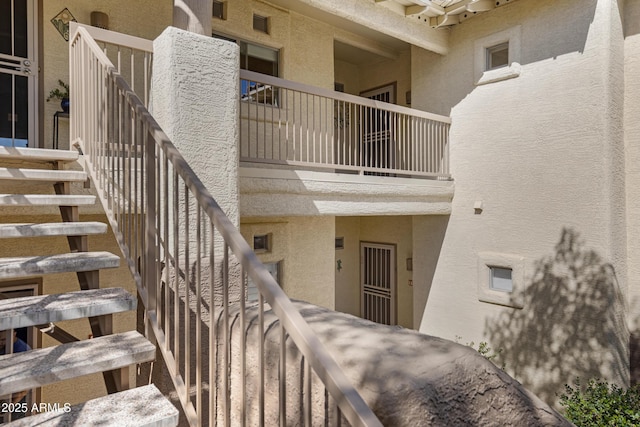 property entrance featuring stucco siding