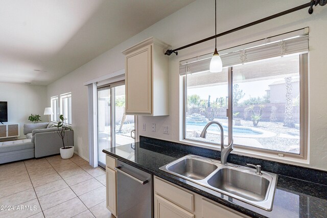 kitchen with dishwasher, decorative light fixtures, sink, and plenty of natural light