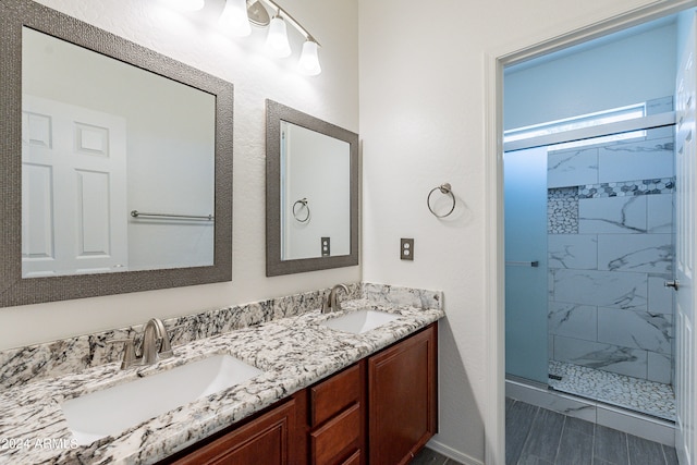 bathroom featuring vanity and an enclosed shower