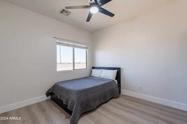 bedroom with ceiling fan and light wood-type flooring