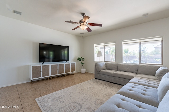 tiled living room with ceiling fan