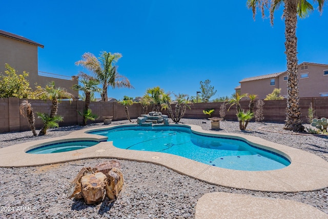 view of pool with an in ground hot tub and a patio area