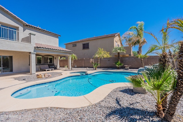 view of pool featuring a patio