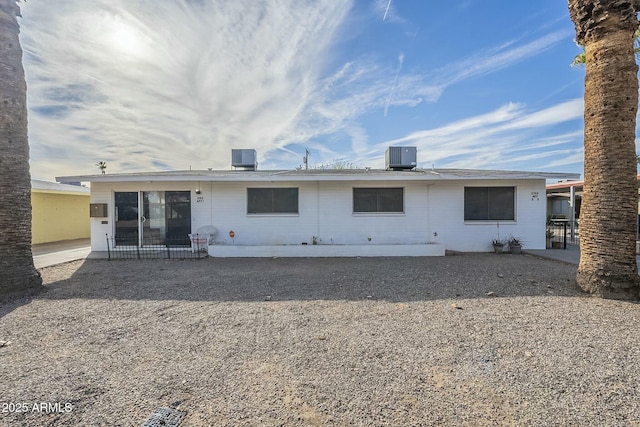 rear view of house featuring central AC and a patio