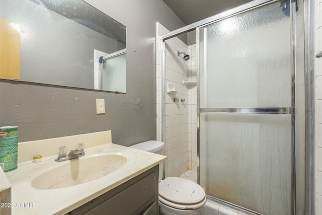 bathroom featuring a stall shower and toilet