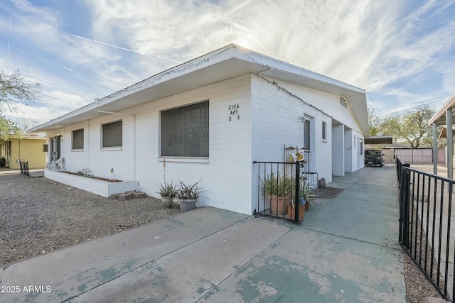 view of side of property with fence