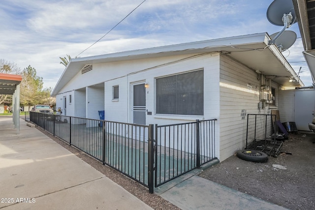 view of property exterior featuring fence