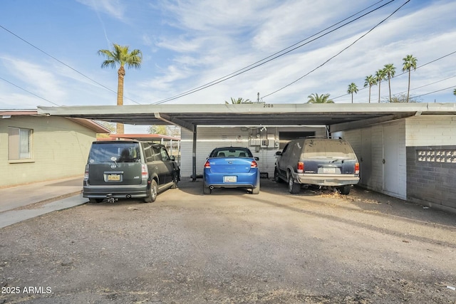 view of parking / parking lot featuring a carport