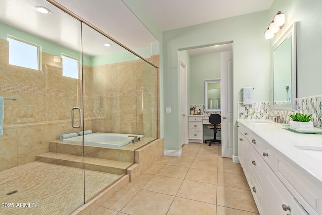 bathroom featuring a shower stall, a relaxing tiled tub, tile patterned floors, double vanity, and backsplash