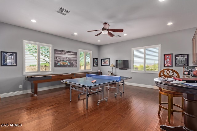 recreation room featuring baseboards, recessed lighting, dark wood-style floors, visible vents, and ceiling fan