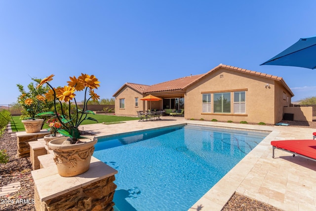 view of swimming pool featuring a fenced in pool and a patio