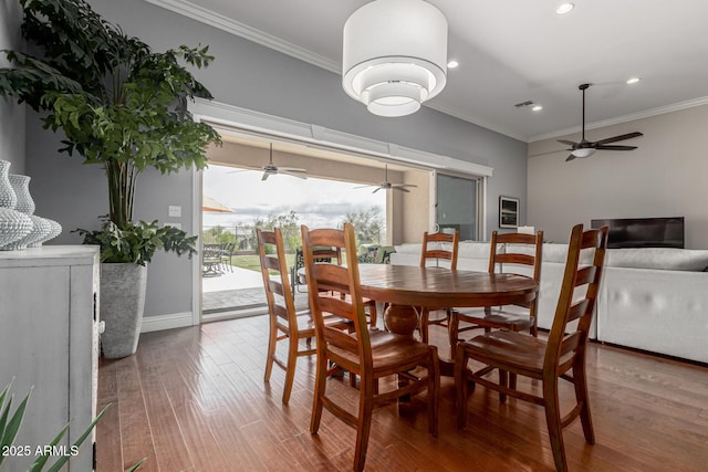 dining space with wood finished floors, recessed lighting, crown molding, and ceiling fan