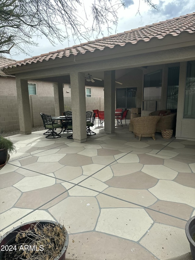 view of patio / terrace with an outdoor living space and ceiling fan