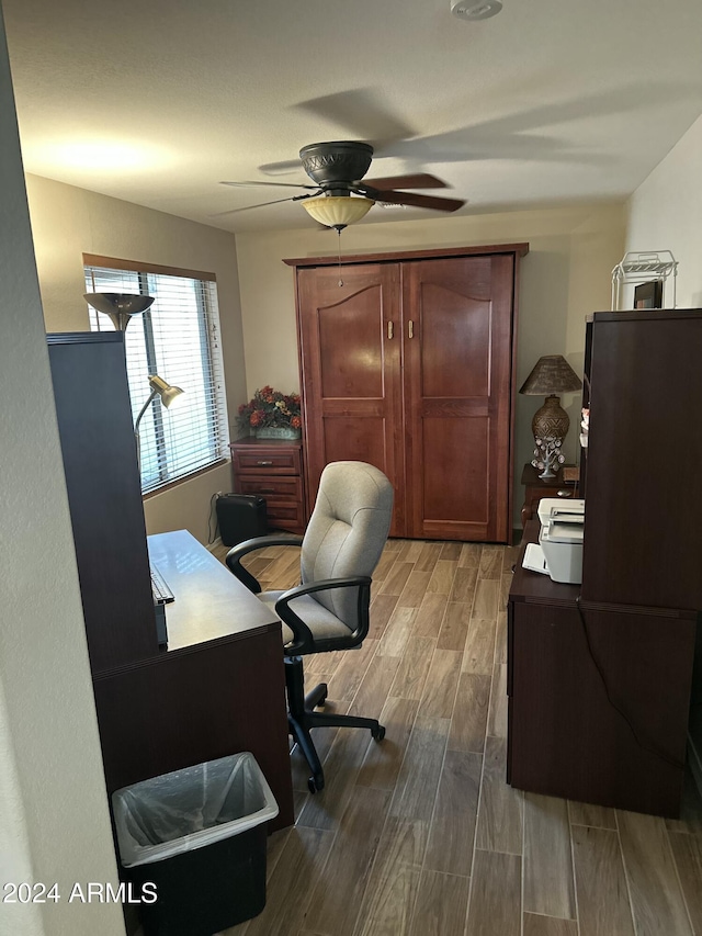 office space with ceiling fan and hardwood / wood-style flooring