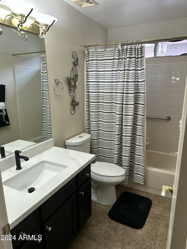 full bathroom featuring a textured ceiling, vanity, shower / bathtub combination with curtain, tile patterned flooring, and toilet