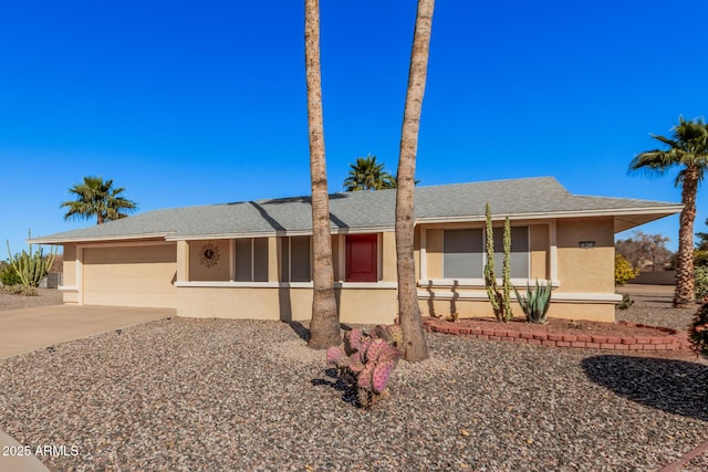 ranch-style house featuring a garage