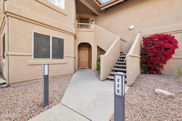 view of exterior entry with stucco siding