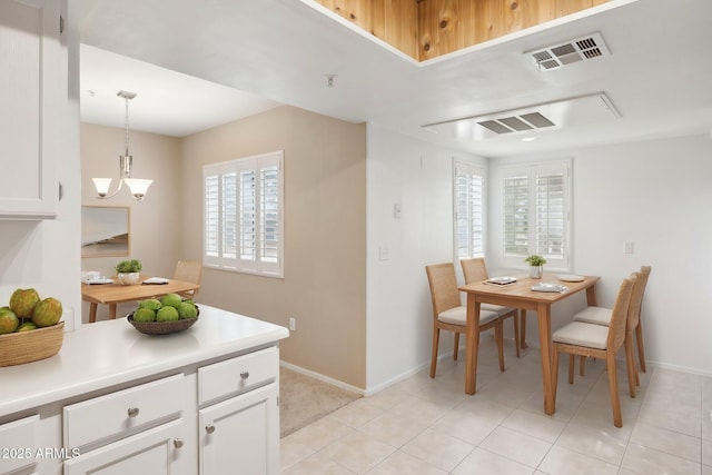 dining room featuring baseboards, light tile patterned floors, a notable chandelier, and visible vents