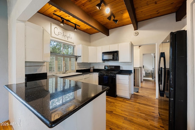 730 Mingus Ave, Prescott, AZ 86301 - kitchen with black appliances, wooden ceiling with exposed beams, track lighting, a sink, and a peninsula