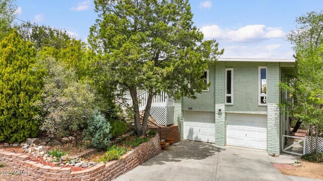 730 Mingus Ave, Prescott, AZ 86301 - view of front of home with concrete driveway, a garage, and brick siding
