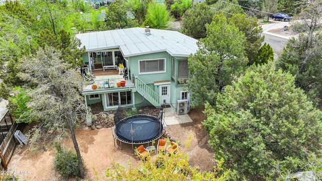 730 Mingus Ave, Prescott, AZ 86301 - back of property featuring a trampoline, stairway, and stucco siding