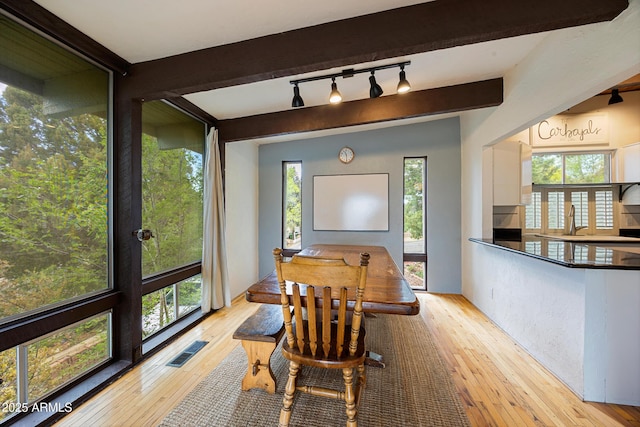 730 Mingus Ave, Prescott, AZ 86301 - dining area featuring light wood finished floors, track lighting, healthy amount of natural light, and beam ceiling