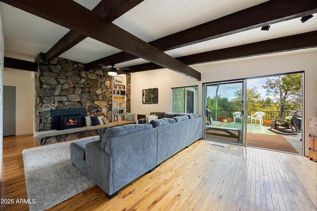 730 Mingus Ave, Prescott, AZ 86301 - living room featuring hardwood / wood-style flooring, a ceiling fan, beam ceiling, and a fireplace