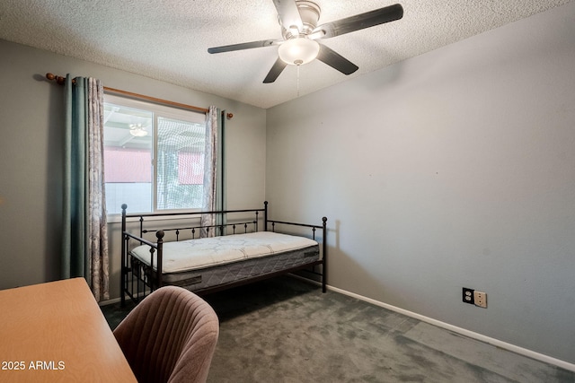 carpeted bedroom with ceiling fan and a textured ceiling