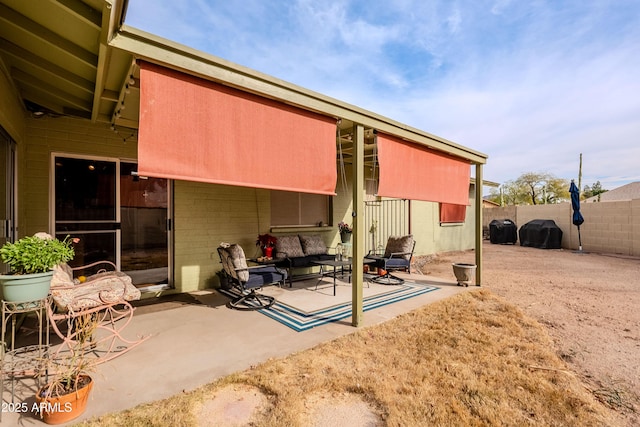 rear view of house featuring a patio and outdoor lounge area