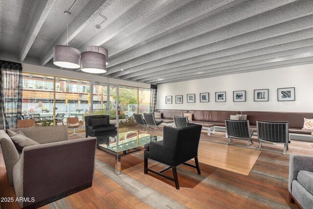lobby featuring beam ceiling