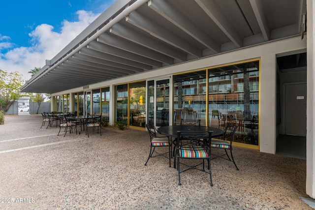 view of patio featuring outdoor dining area