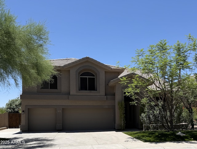 33220 N 60th Way, Scottsdale, AZ 85266 - traditional-style home featuring an attached garage, stucco siding, a tile roof, and driveway