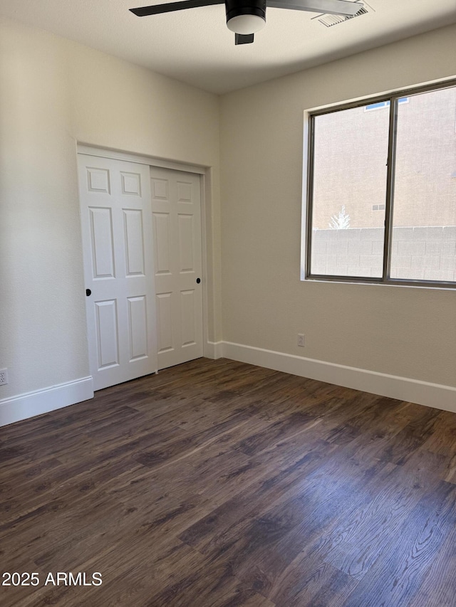 33220 N 60th Way, Scottsdale, AZ 85266 - unfurnished bedroom featuring a closet, dark wood-type flooring, and ceiling fan
