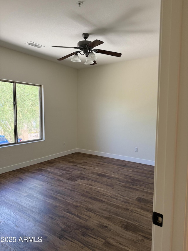 33220 N 60th Way, Scottsdale, AZ 85266 - empty room featuring dark wood finished floors and ceiling fan
