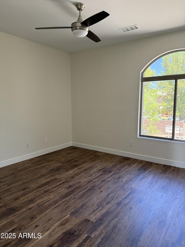 33220 N 60th Way, Scottsdale, AZ 85266 - spare room featuring dark wood-type flooring and a ceiling fan