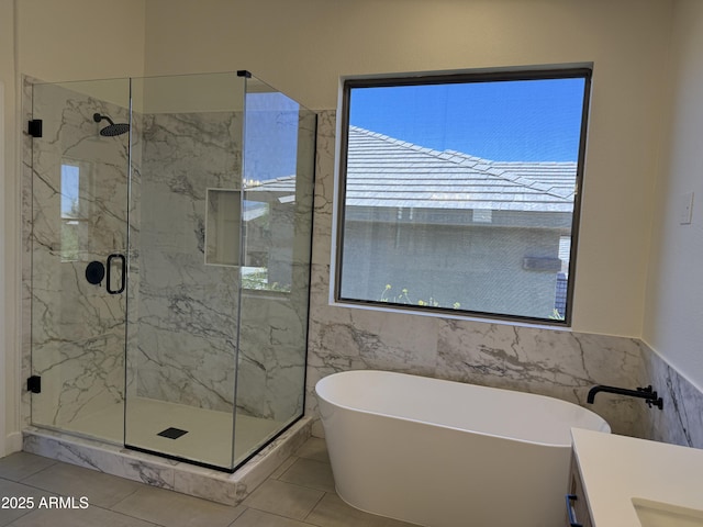 33220 N 60th Way, Scottsdale, AZ 85266 - bathroom with tile walls, a freestanding tub, a marble finish shower, vanity, and tile patterned flooring