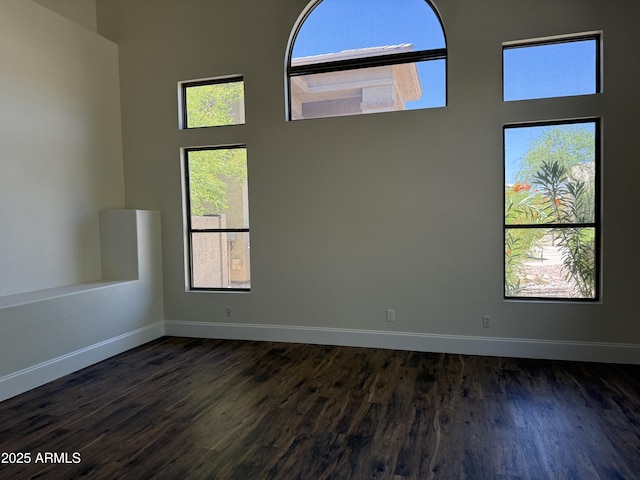 33220 N 60th Way, Scottsdale, AZ 85266 - empty room with dark wood-type flooring and a high ceiling