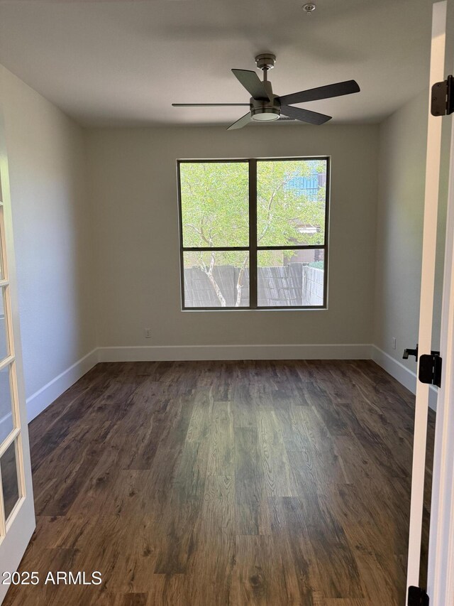 33220 N 60th Way, Scottsdale, AZ 85266 - empty room with dark wood-type flooring and ceiling fan