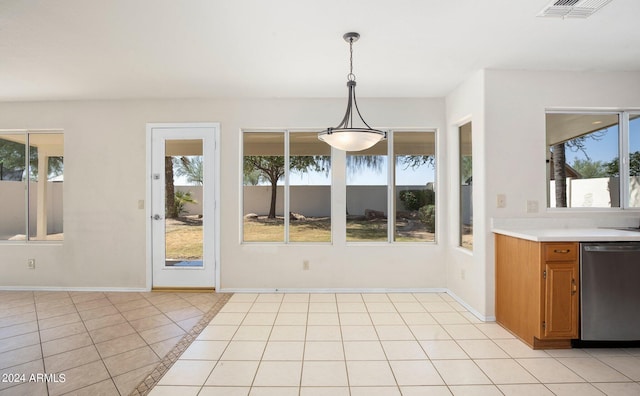 unfurnished dining area with light tile patterned floors