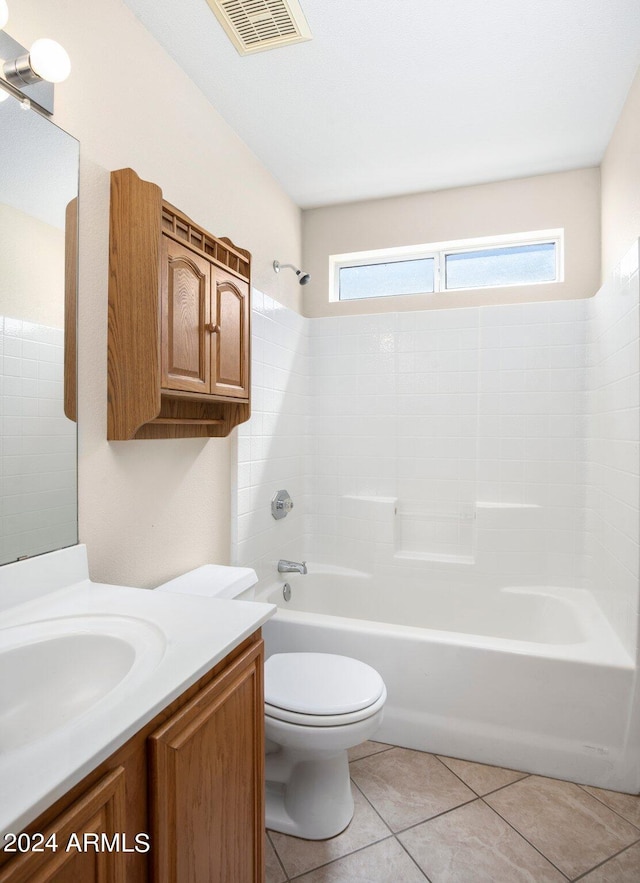 full bathroom with tub / shower combination, tile patterned floors, vanity, and toilet