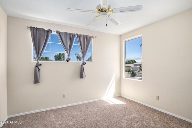 carpeted empty room with ceiling fan