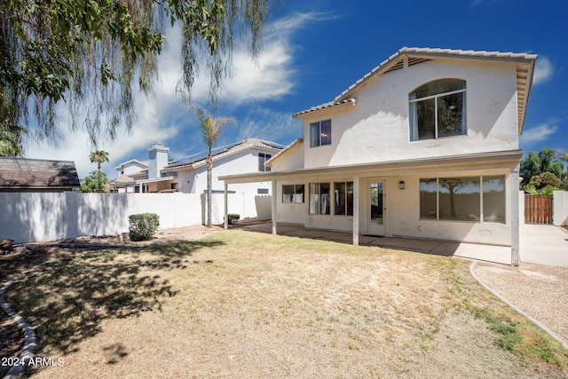 back of property featuring a patio