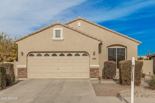 view of front of property with a garage