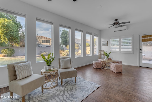 sunroom featuring a healthy amount of sunlight, ceiling fan, and a wall mounted air conditioner