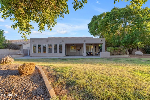 back of house with a yard