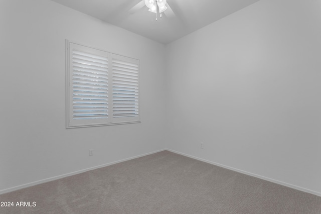 carpeted empty room with ceiling fan